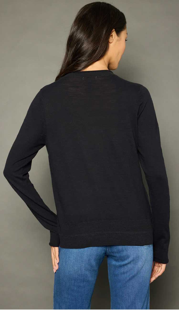 Lisa Todd Zipcode Sweater in black with white hand-stitch detail and pink zipper for a pop of color. Shop Paula & Chlo back view 