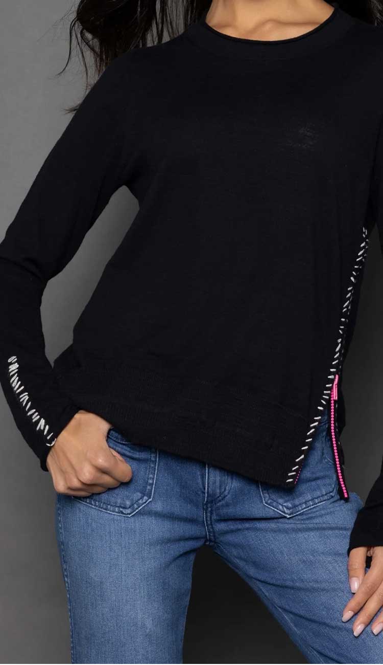 Lisa Todd Zipcode Sweater in black with white hand-stitch detail and pink zipper for a pop of color. Shop Paula & Chlo - detail view 