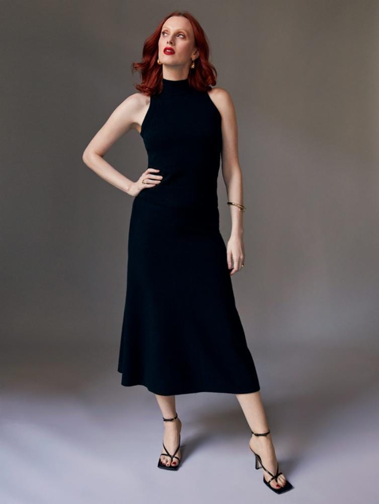 White + Warren Midi Cashmere Skirt in black cashmere with an a-line cut. Back view. shown with the sleeveless mockneck cashmere top in black shown with A line cashmere skirt.