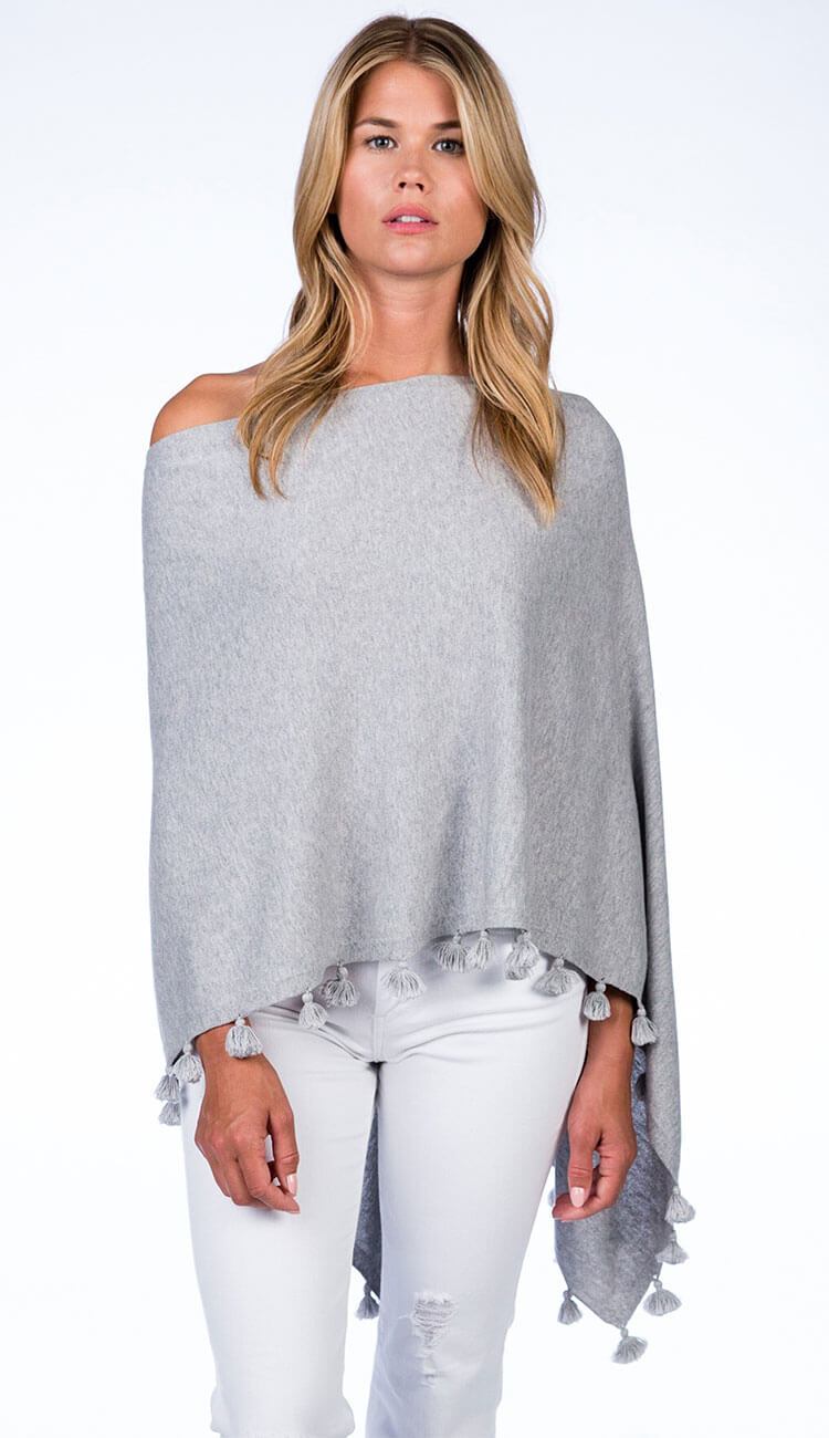 ALASHAN CASHMERE TOSSEL TOPPER IN light ash grey OVER BLUE JEANS