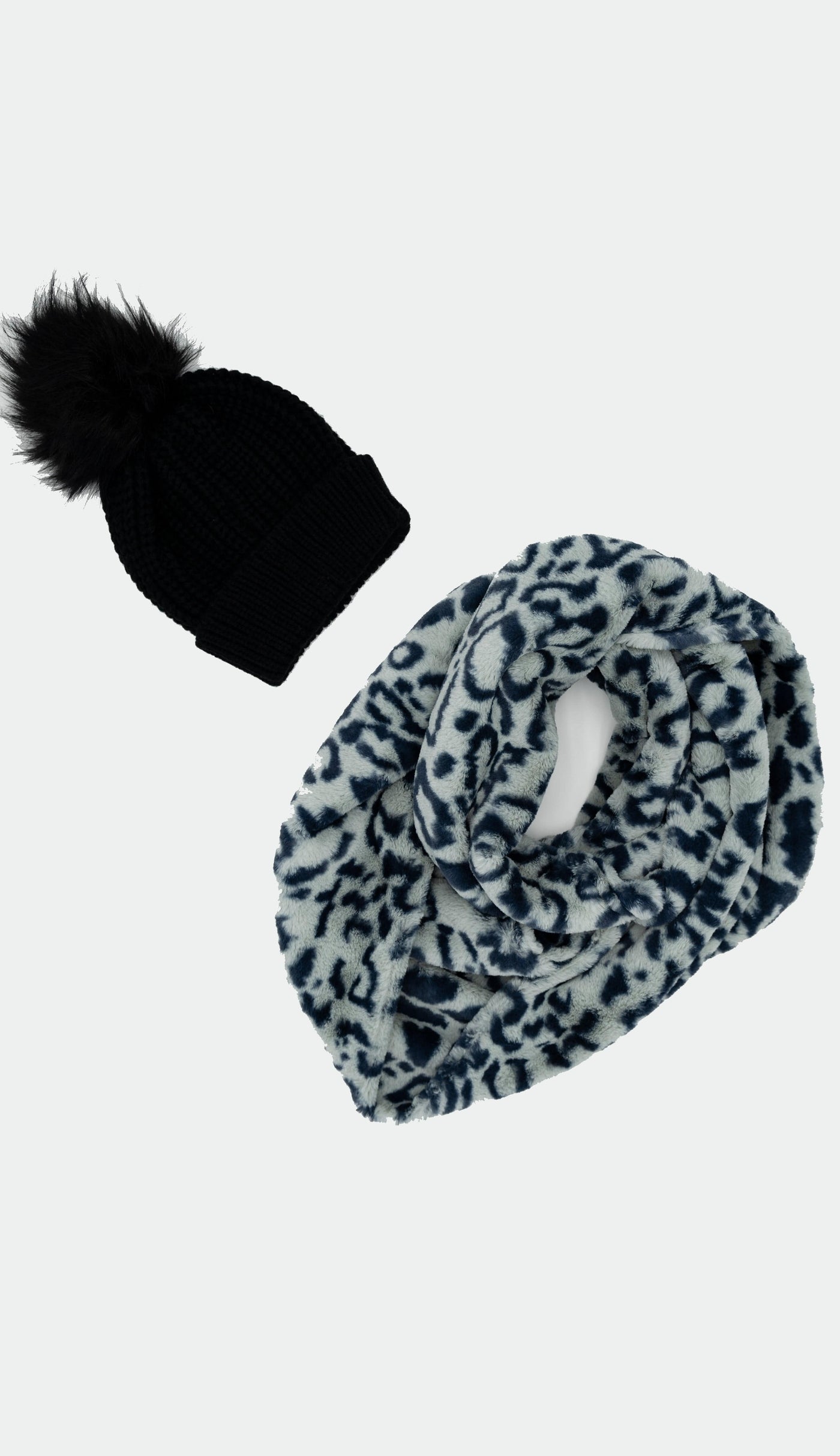 light blue leopard infinity faux fur scarf shown with navy knit faux fur pom pom hat - sold separately 