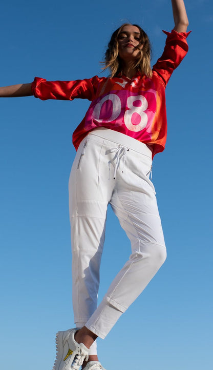 Raffaello Rossi Candy Pant in white women’s slim jogger pant with drawstring waist and zip pockets