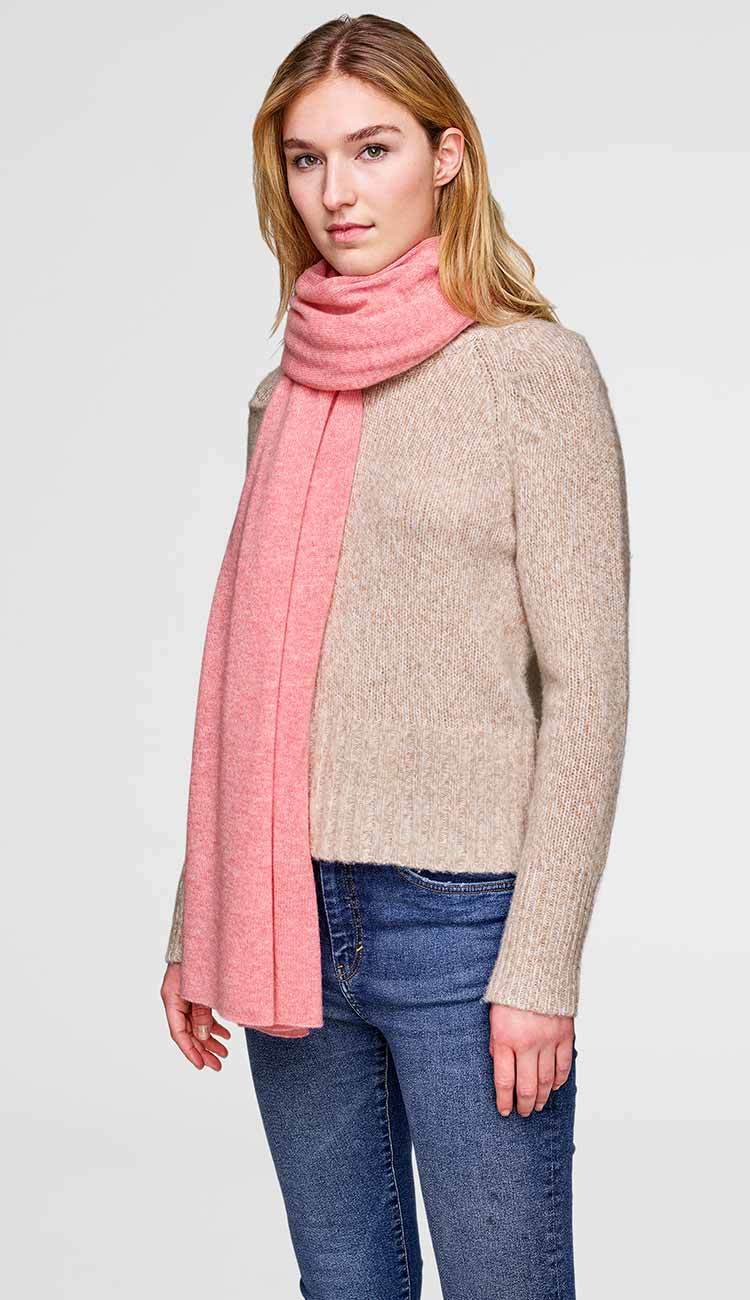 White + Warren cashmere travel wrap in Bubble Gum Pink, a lightweight rectangular 100% cashmere wrap styled as a scarf.