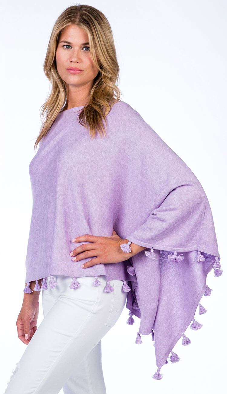 ALASHAN CASHMERE TOSSEL TOPPER IN lavender ice OVER BLUE JEANS
