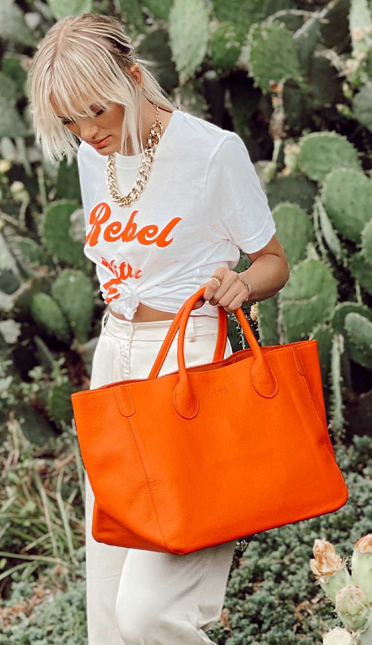 Marie Medium Tote . This beautiful orange tote handbag is done in a pebble grain leather by Beck bags.