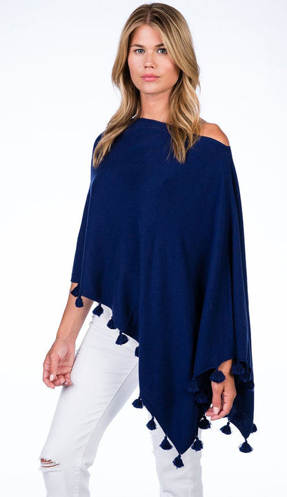 ALASHAN CASHMERE TOSSEL TOPPER IN navy OVER BLUE JEANS