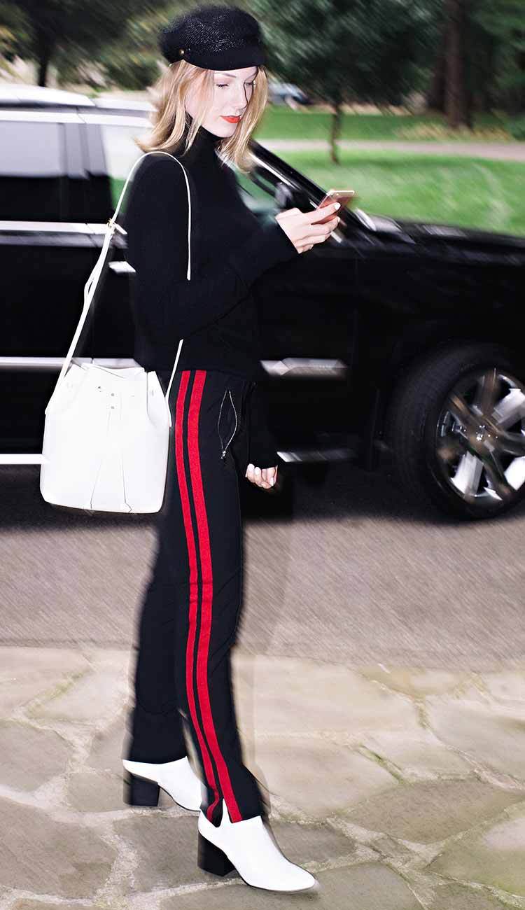 oui athleisure pant in black with red stripe detail