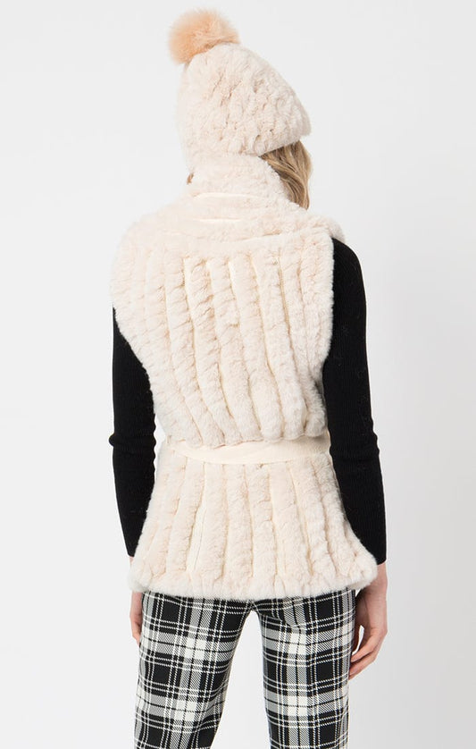 tazmin gallet vest in fur cream color with plad pants and black sweater 