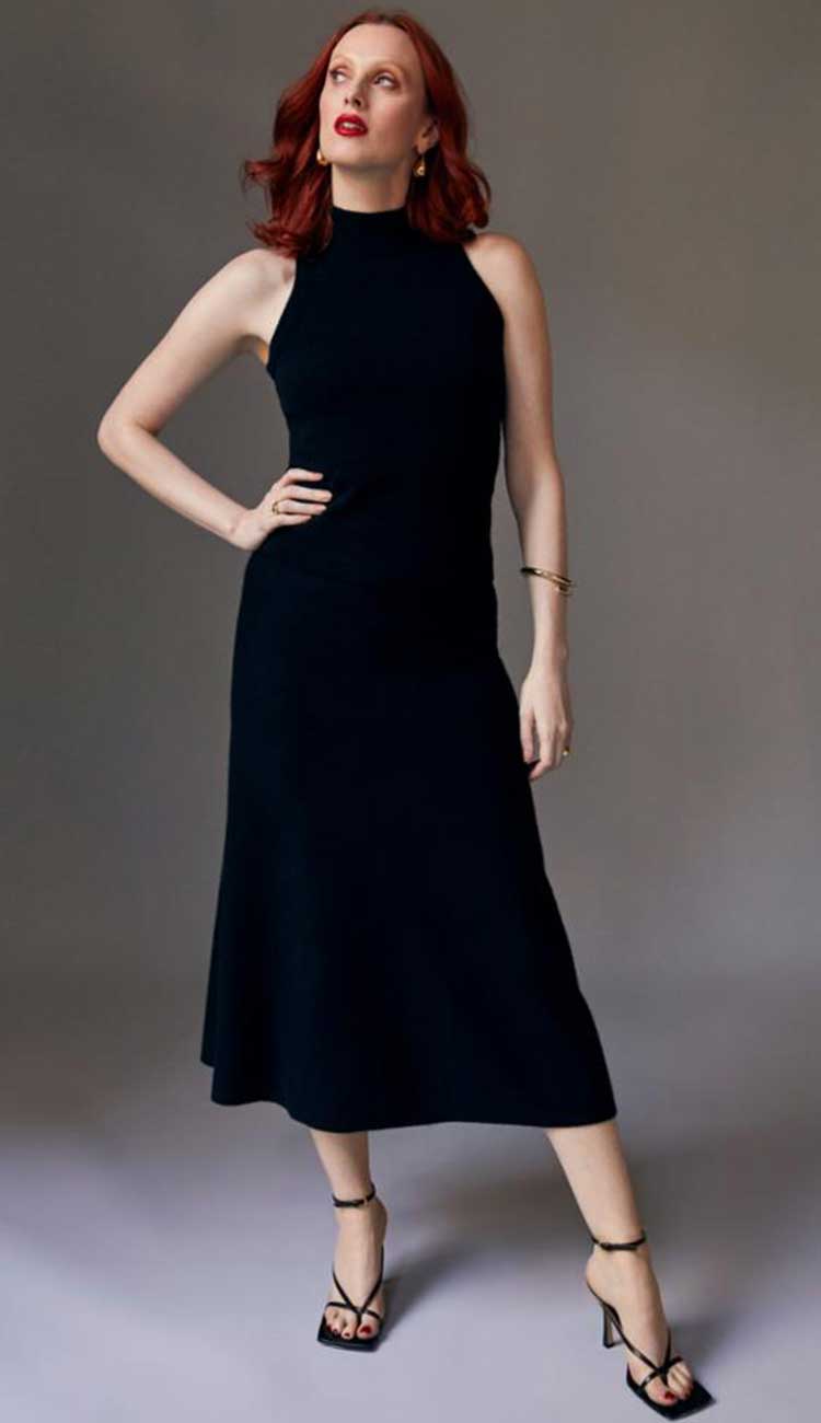 White + Warren Midi Cashmere Skirt in black cashmere with an a-line cut. Back view. shown with the sleeveless mock neck cashmere top