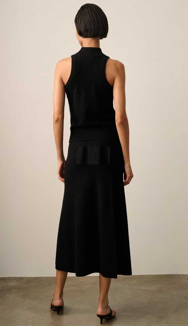 White + Warren Midi Cashmere Skirt in black cashmere with an a-line cut. Back view. shown with the sleeveless mockneck cashmere top