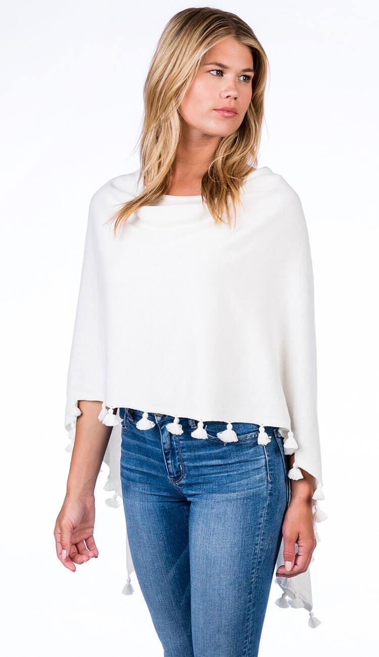 ALASHAN CASHMERE TOSSEL TOPPER IN white OVER BLUE JEANS