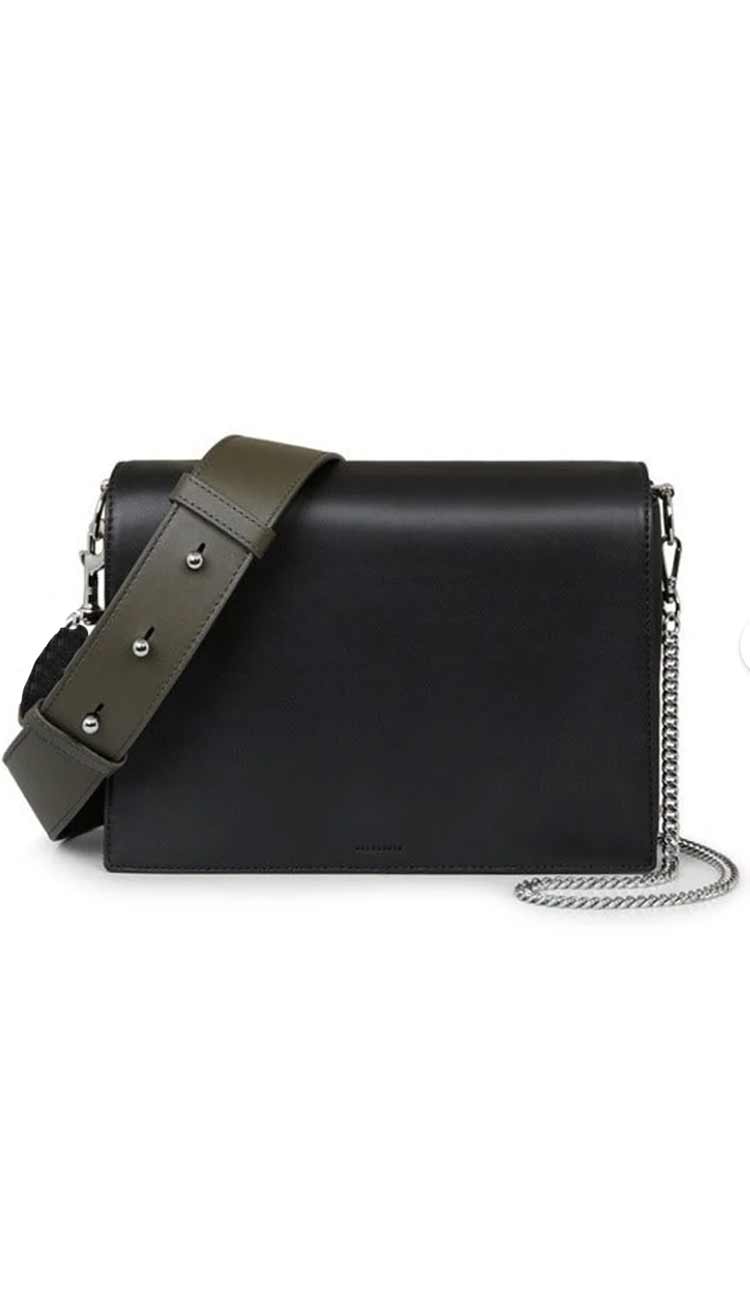 A black leather box bag with a wide shoulder strap and a detachable metal chain, featuring silver-tone hardware.